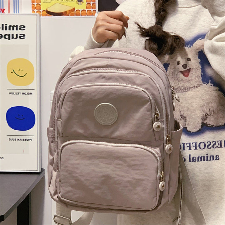 Durable unisex daily backpack with multiple compartments for organized school, work, or travel essentials.