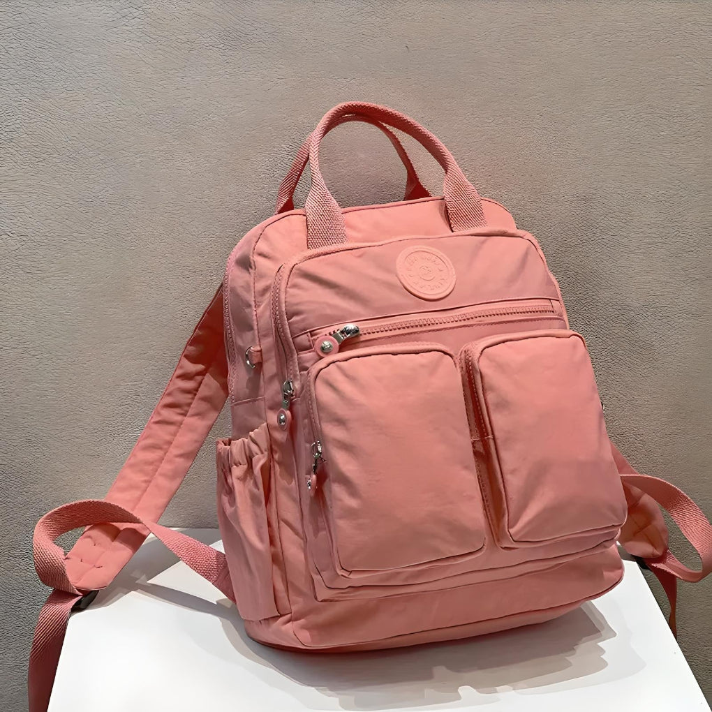 Durable water-resistant unisex commuter backpack, built for everyday use, school, work, and travel organization.