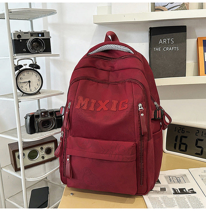 Stylish multi-pocket graphic print backpack for school or travel. Unisex design ensures comfort and ample storage.