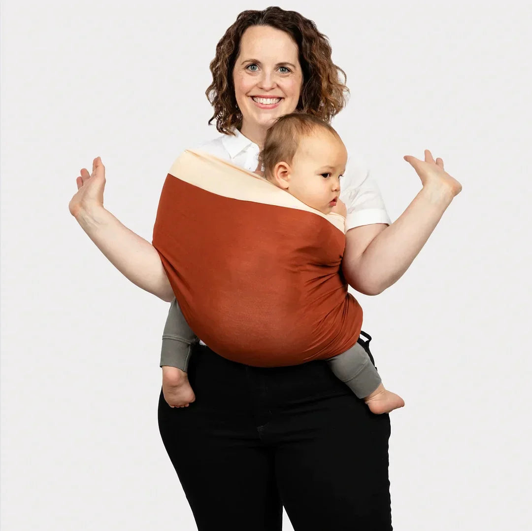 Comfortable infant carrier wrap, hands-free design for parents. A versatile & essential babywearing solution.