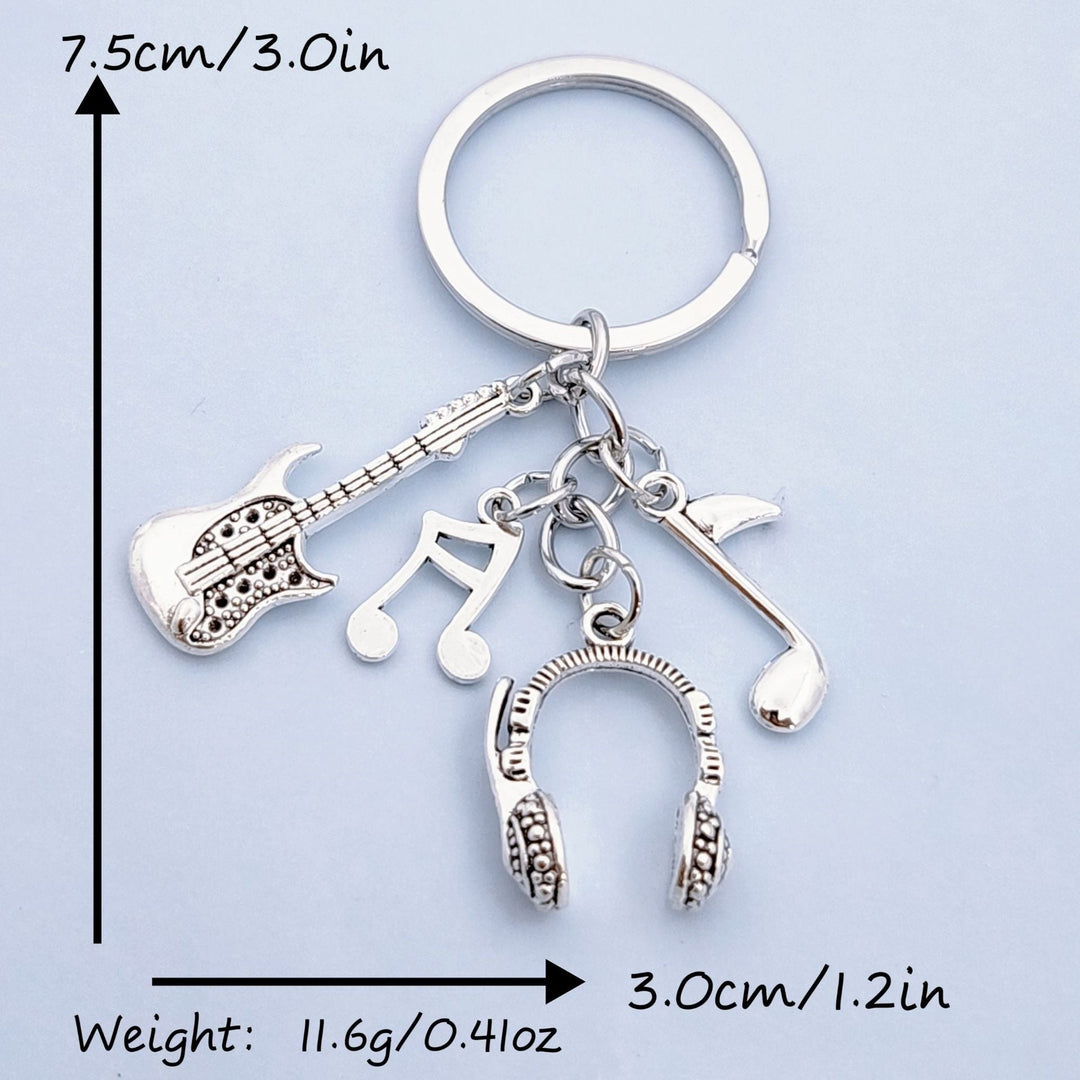 Decorative unisex metal keychain charm with musical instruments & notes, a great gift for music lovers.