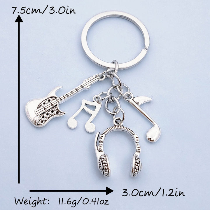 Decorative unisex metal keychain charm with musical instruments & notes, a great gift for music lovers.