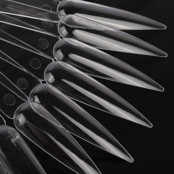 Clear artificial nail practice tips on a display ring, ideal for nail art design & manicure training for all skill levels.