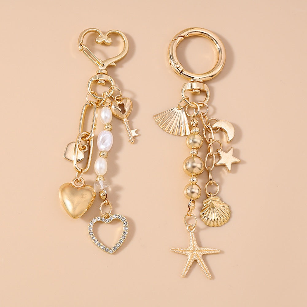 Unisex nautical charm keychain with anchor and ship wheel, a durable maritime accessory for keys.
