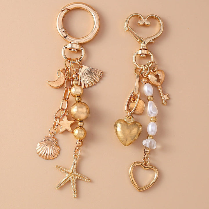 Close-up of a rustic metal anchor charm on a sturdy unisex keychain, ideal for sea lovers.