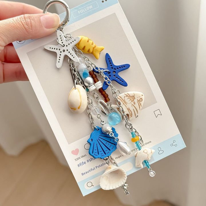 Unisex nautical charm keychain with ocean-inspired blue elements, perfect sea accessory or gift.