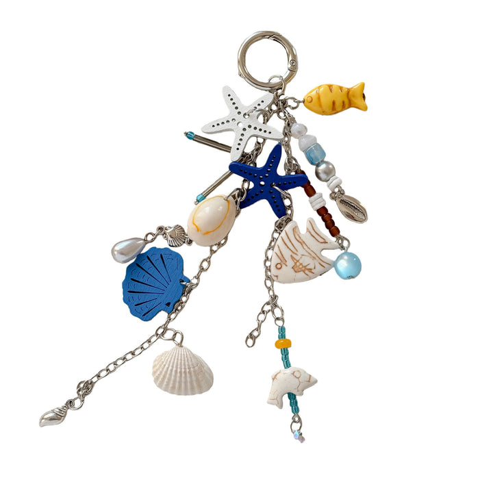 Versatile unisex keychain with assorted blue nautical & sea charms, a charming ocean accessory.