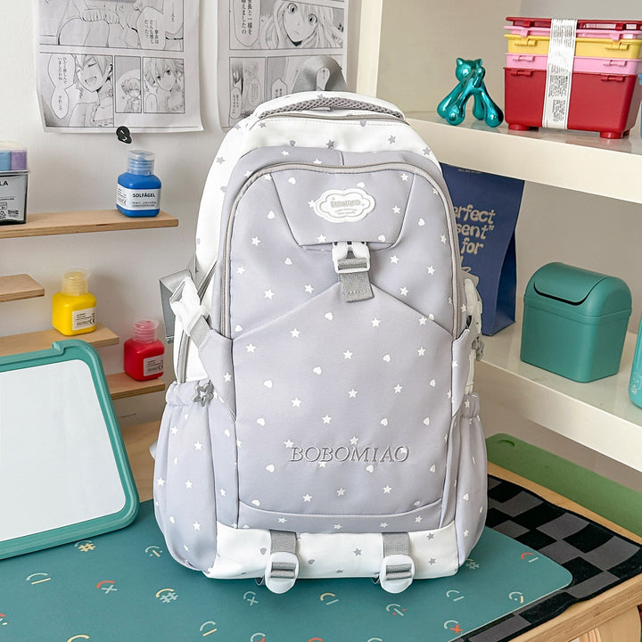 Fashionable unisex star pattern backpack in durable fabric for school, travel, and daily use. A stylish student bag.