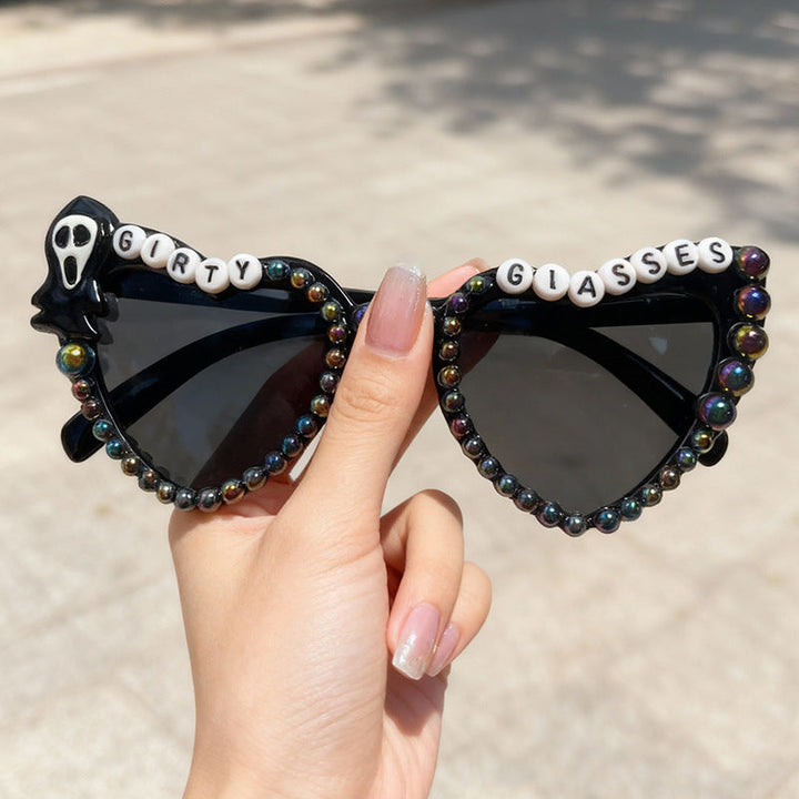 Unisex model wearing chic cat-eye novelty sunglasses, ready for a festival or party. A bold fashion statement.