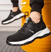 Unisex protective work shoes offering orthopedic comfort, slip resistance & puncture proof safety.