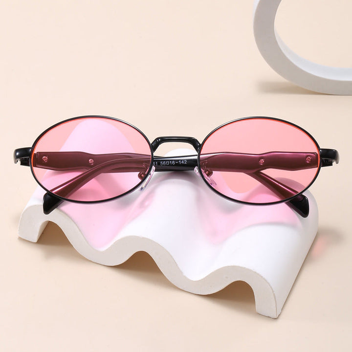 Sleek oval fashion sunglasses, unisex design, lightweight frame, essential eye protection for sunny days.