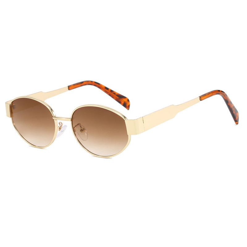 Person wearing unisex oversized metal frame sunglasses, a perfect beach essential for sun protection.