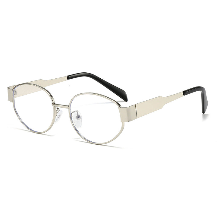 Dark lenses of oversized metal frame sunglasses ensuring UV protection. Stylish unisex eyewear.