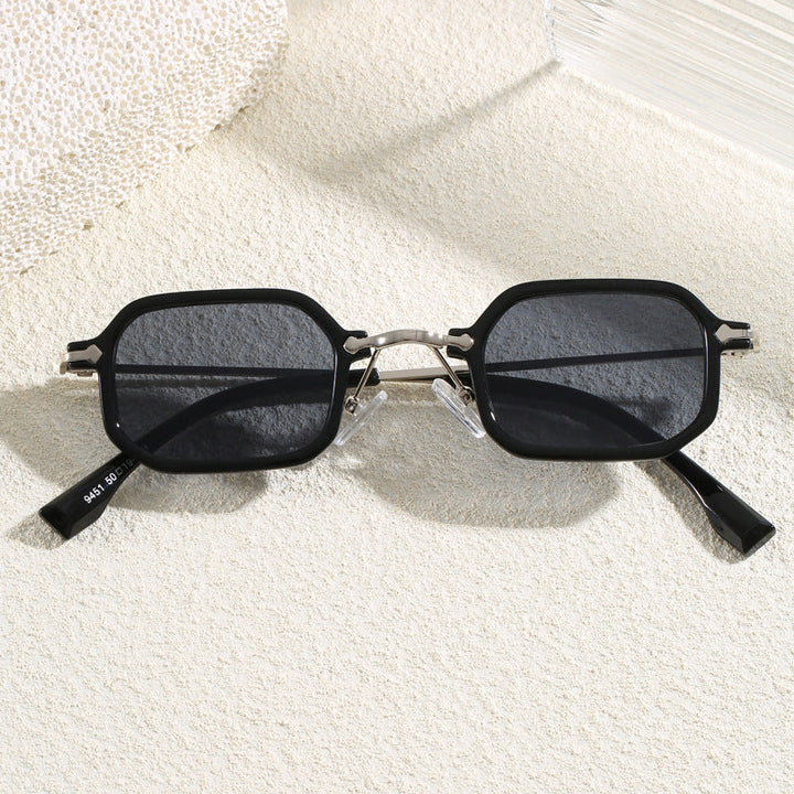 Stylish black oversized sunglasses for men & women, essential eye protection & fashion statement.