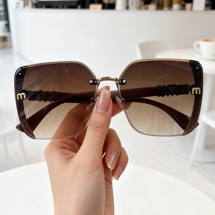 Fashionable oversized unisex sunglasses with UV400 protection. Stylish eyewear, a summer essential for eye safety & style.