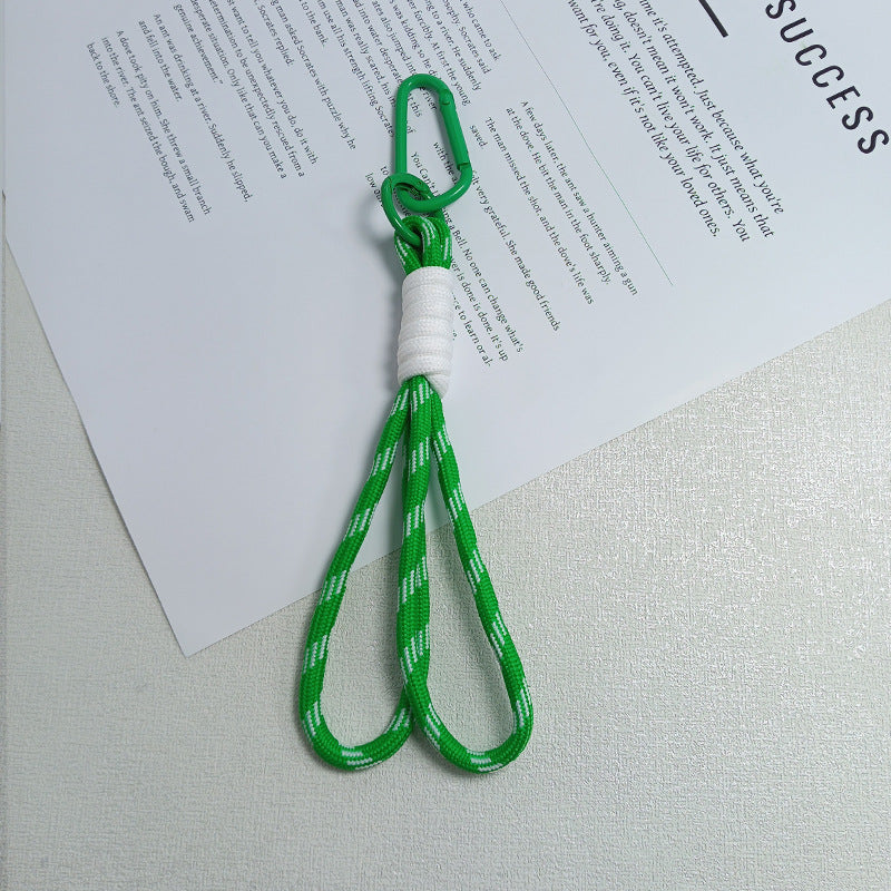 Unisex paracord keychain holder for EDC. Durable outdoor survival accessory with carabiner clip.