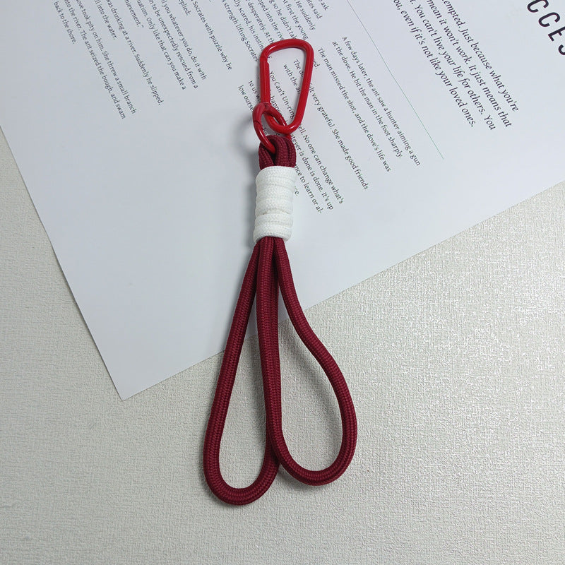 Heavy-duty paracord keychain, perfect for outdoor enthusiasts needing reliable gear.