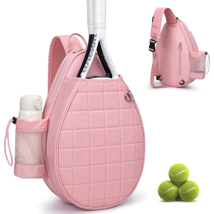 Interior of pink/black unisex tennis bag, showing compartments for shoes, balls, & athletic gear.