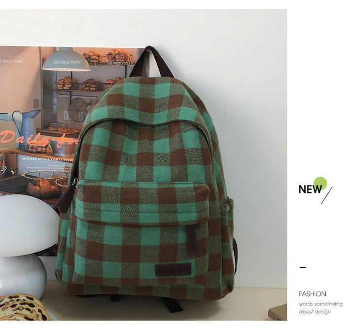Trendy unisex plaid casual bag from a side angle, featuring multiple compartments for organized everyday carry.