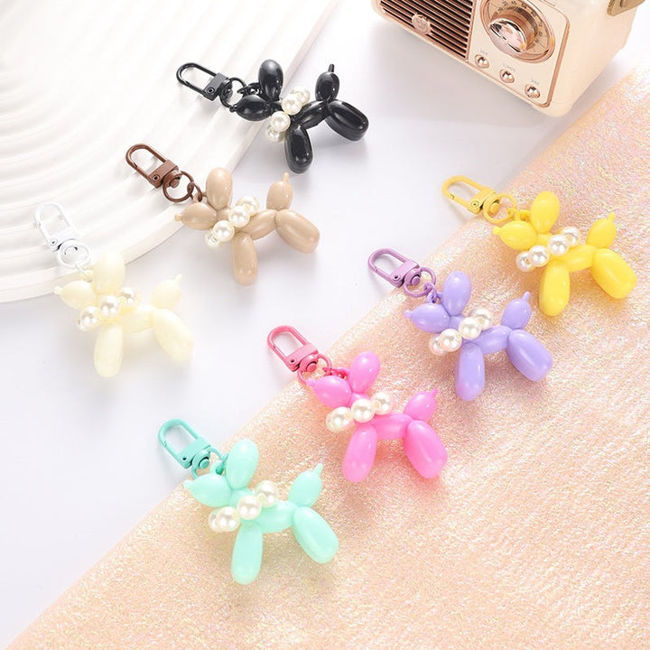 Colorful balloon dog keychain, a vibrant key holder & elegant bead charm for bags.