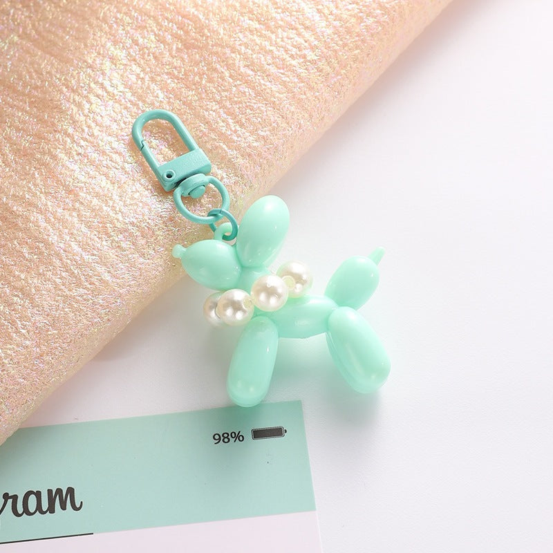 Playful balloon dog key holder, featuring an elegant bead charm, perfect for bags.