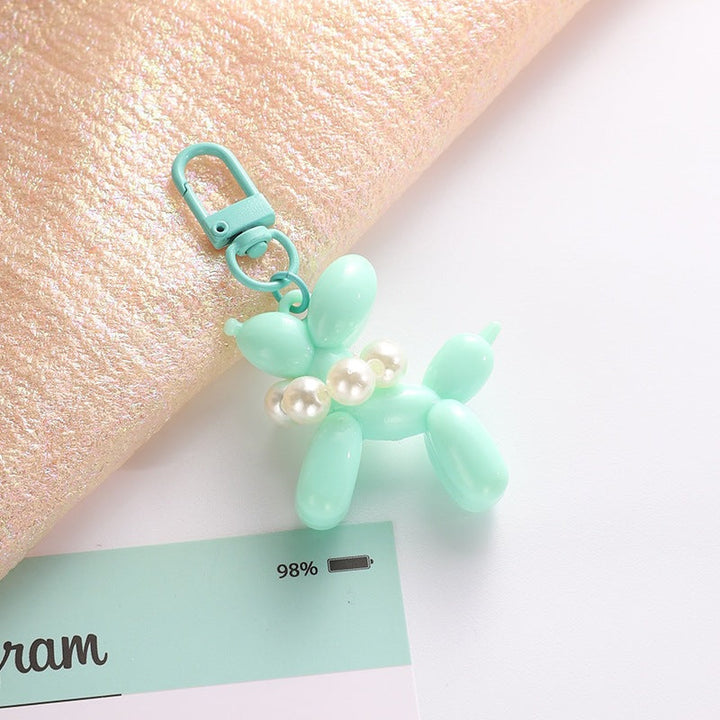 Playful balloon dog key holder, featuring an elegant bead charm, perfect for bags.