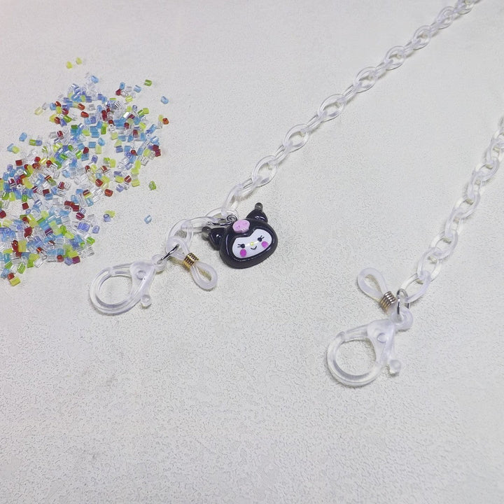 Clear spectacle chain featuring a whimsical dog pendant, a functional and fun eyewear accessory.