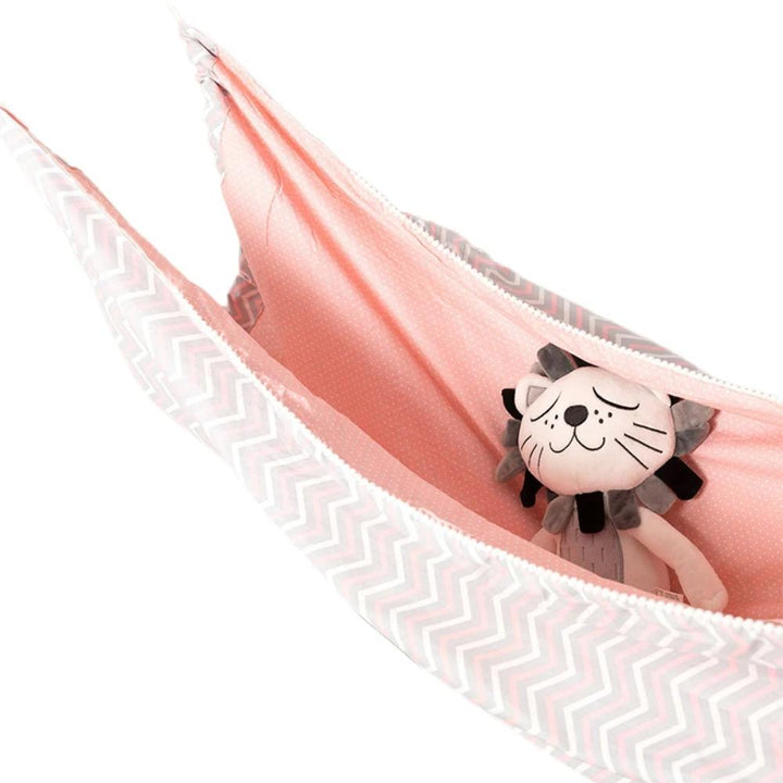 Portable indoor baby hammock with gentle sway, cotton fabric, perfect travel crib for sensory development & calm baby.