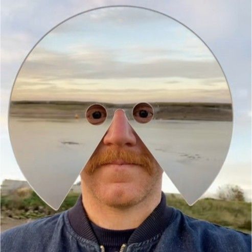 Shiny reflective mirror face mask for unisex adults. Ideal for dance parties, festivals, and unique photo props.