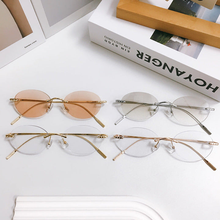 Unisex retro oval sunglasses with UV protection and lightweight metal frame for stylish eyewear.