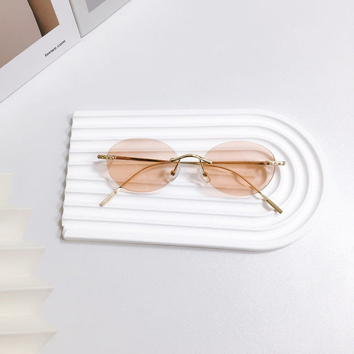 Everyday unisex retro oval sunglasses, lightweight and stylish, offering UV protection.