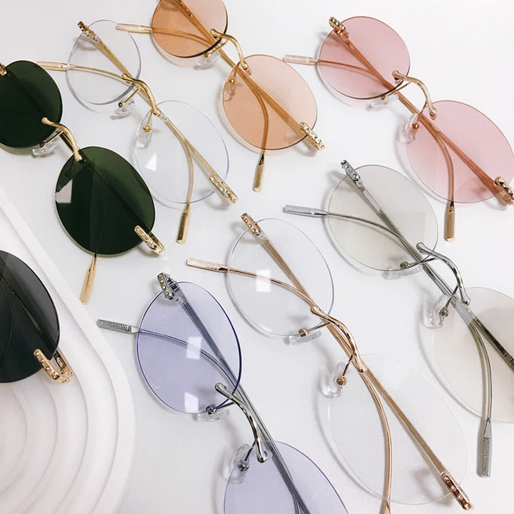 Fashionable unisex retro oval eyewear with durable metal frame & UV protection.