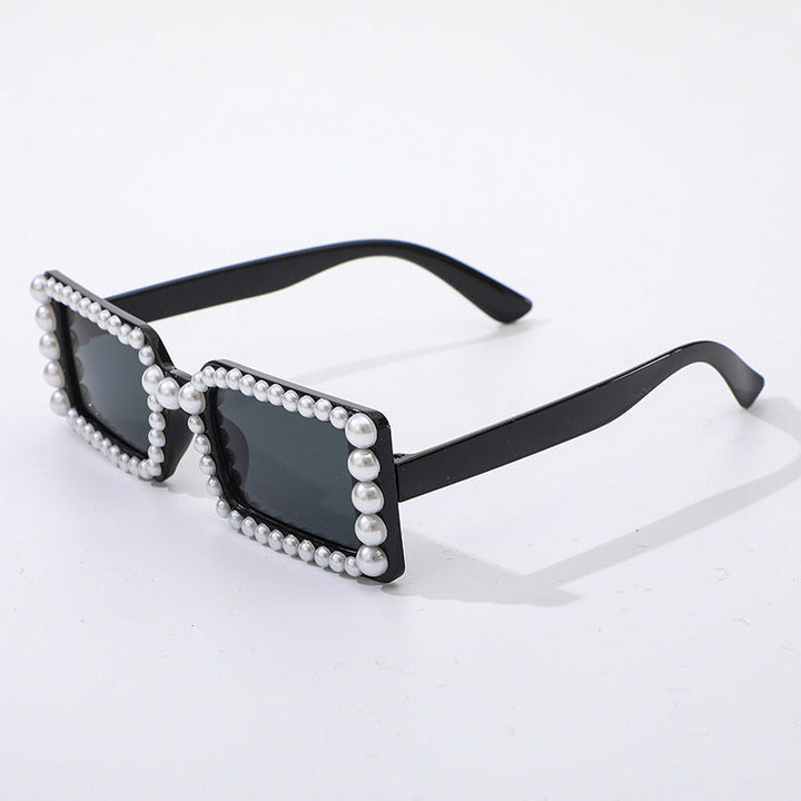 Trendy pearl embellished square sunglasses, perfect retro eyewear for fashion-forward individuals.