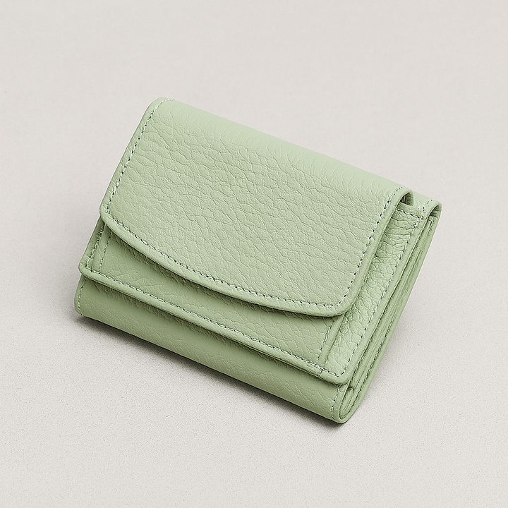 RFID-blocking minimalist leather wallet. Unisex everyday carry with multiple card slots and coin pocket.