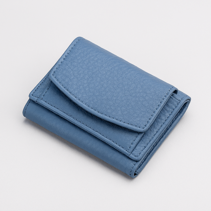 Slim handmade leather travel wallet with RFID protection. Unisex design for secure everyday essentials.