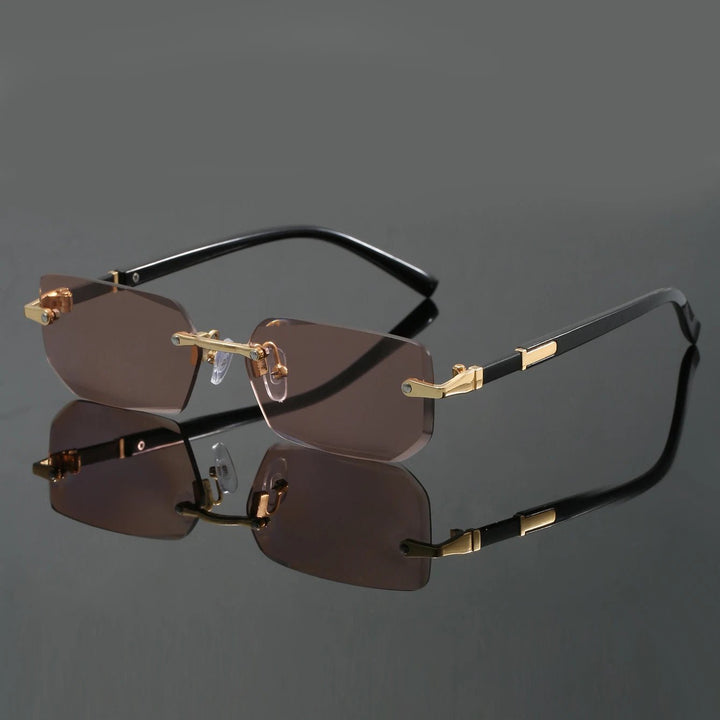 Close-up of modern unisex cut-edge rimless sunglasses, highlighting sleek design & UV400 eye protection.