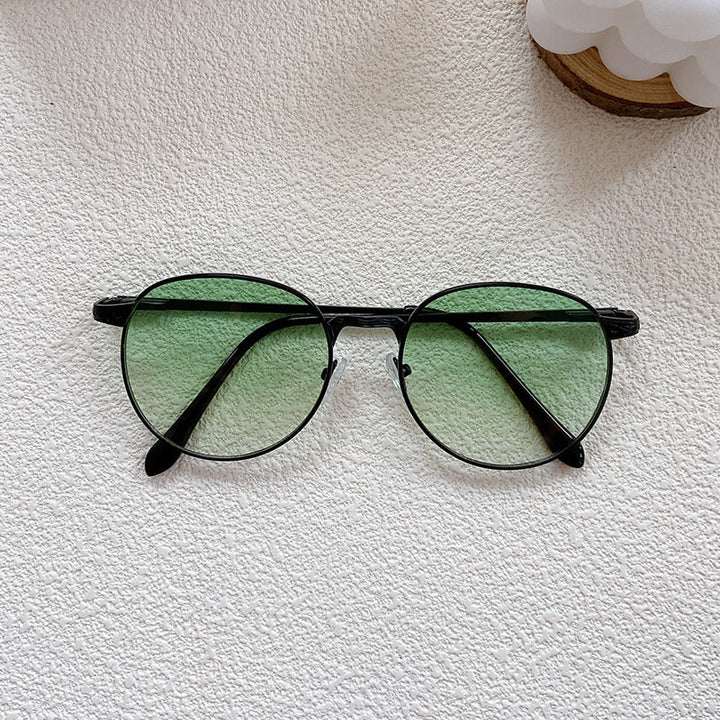 Modern round frame sunglasses, a classic and trendy accessory offering complete UV protection for all.