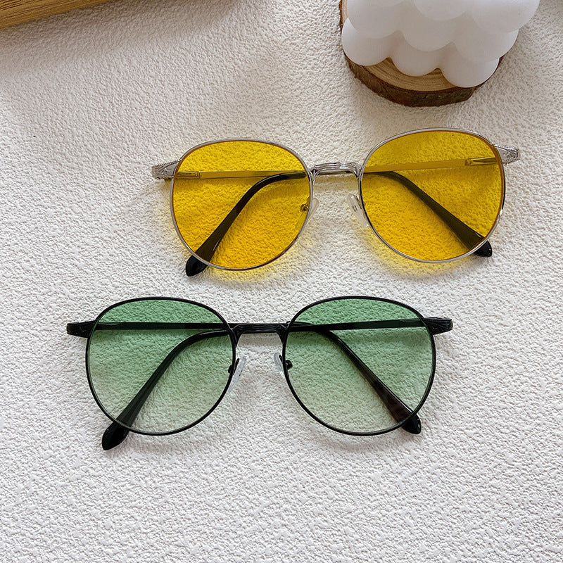 Classic round frame sunglasses, stylish and trendy, offering essential UV eye protection for summer vacations.