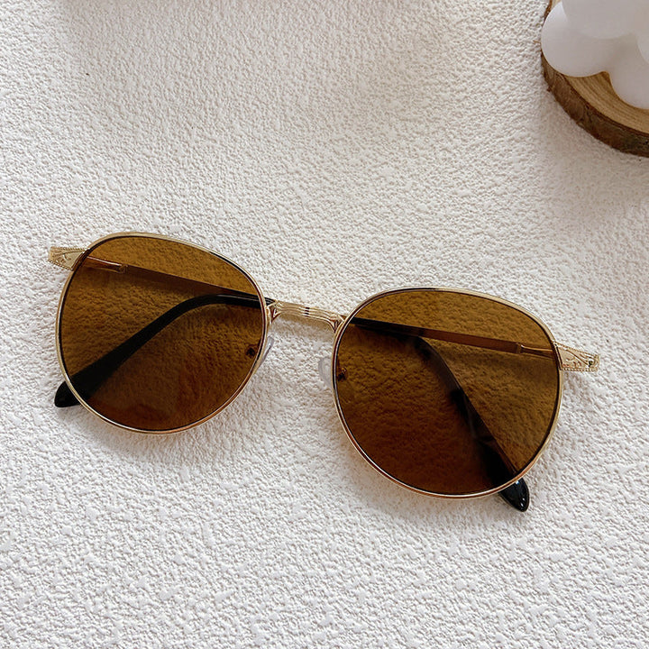 Trendy round frame eyewear, unisex design with superior UV protection, ideal summer fashion accessory.