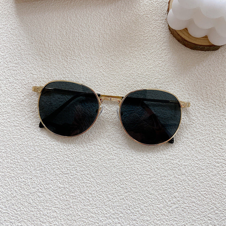 Premium round frame sunglasses, providing elegant style and crucial UV protection for eye health and fashion.