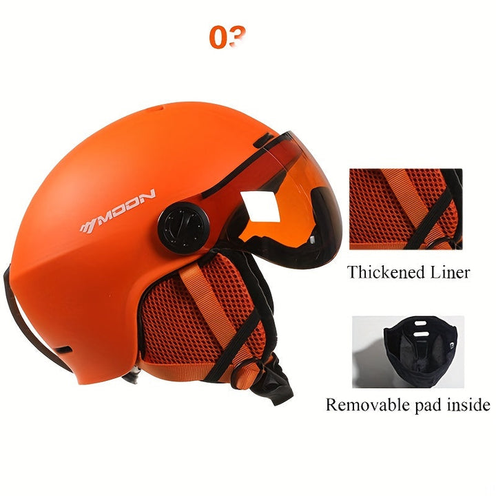 Black protective ski helmet with integrated goggle clip. Essential gear for safe winter sports.