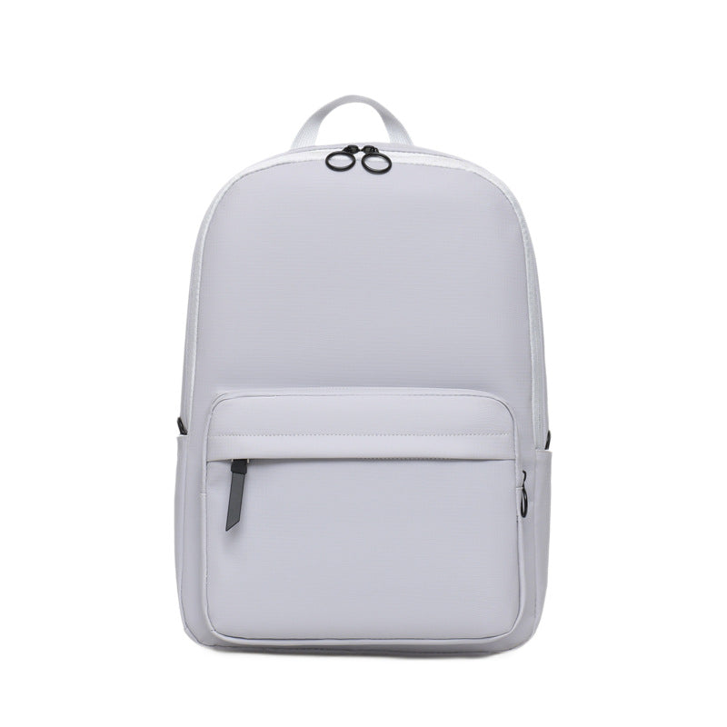 Unisex sleek textured laptop backpack for daily commute, work, or school, featuring a minimalist design.