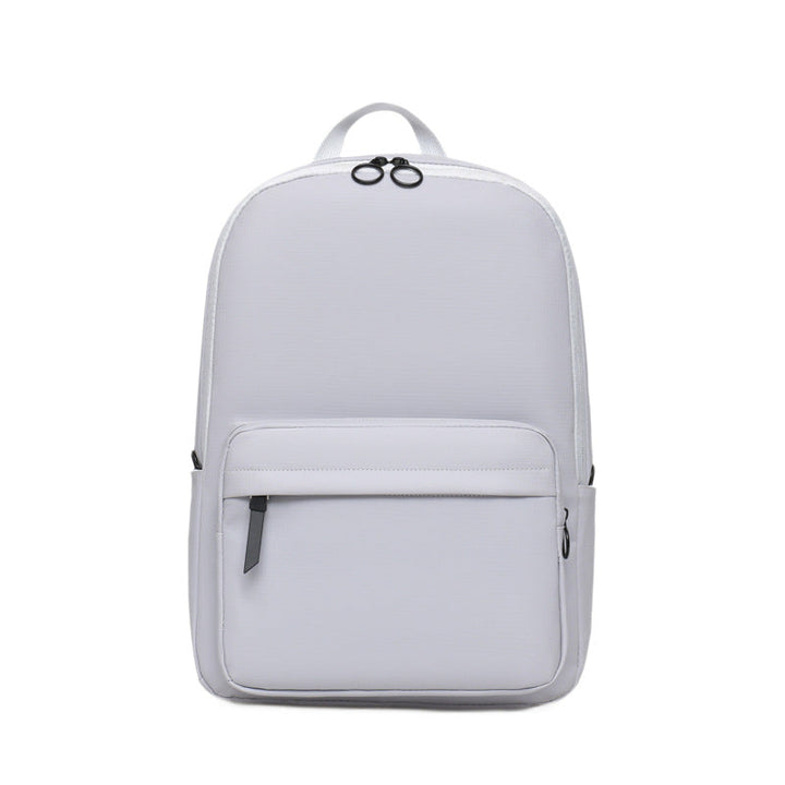 Unisex sleek textured laptop backpack for daily commute, work, or school, featuring a minimalist design.