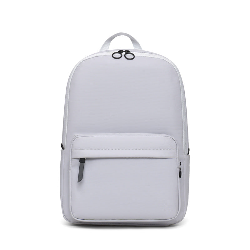 Professional unisex textured daypack, ideal for laptops, travel, and work. Sleek, minimalist design.