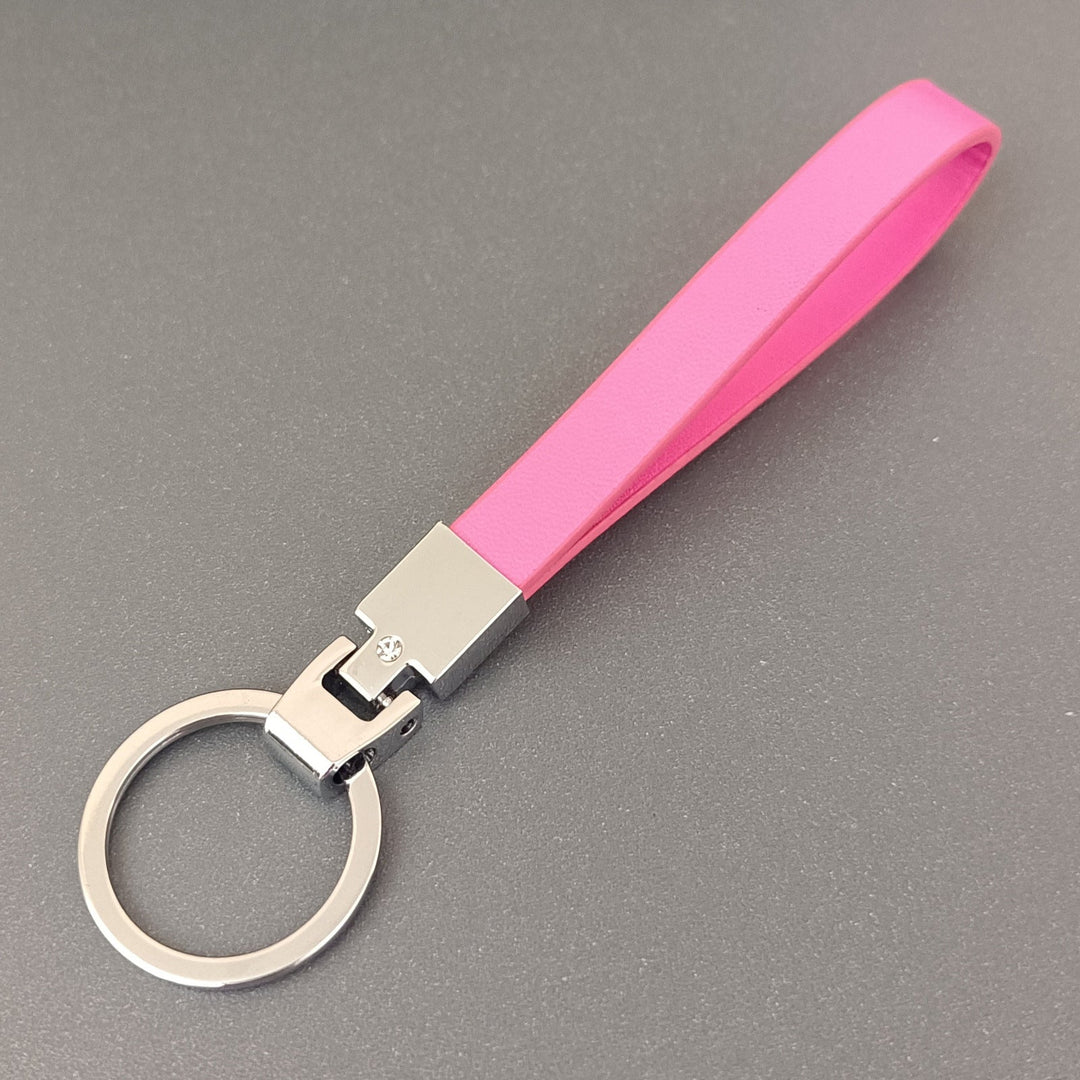 Practical slim leather key holder with keys attached, illustrating its secure and convenient use.