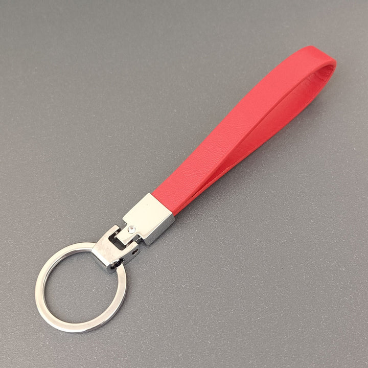 Close-up of a slim leather key holder, highlighting its premium texture and craftsmanship.