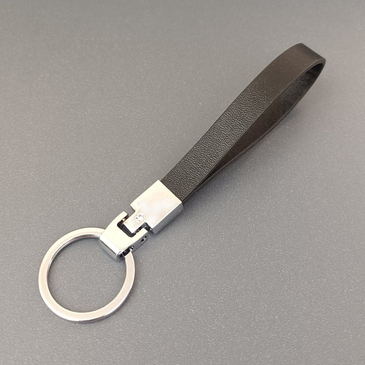 Assortment of colorful slim leather keyrings, showcasing variety and ideal for personalizing keys.