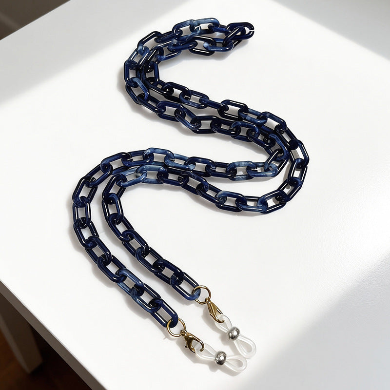 Modern unisex eyewear chain, sleek plastic design, practical spectacle accessory for a polished look.