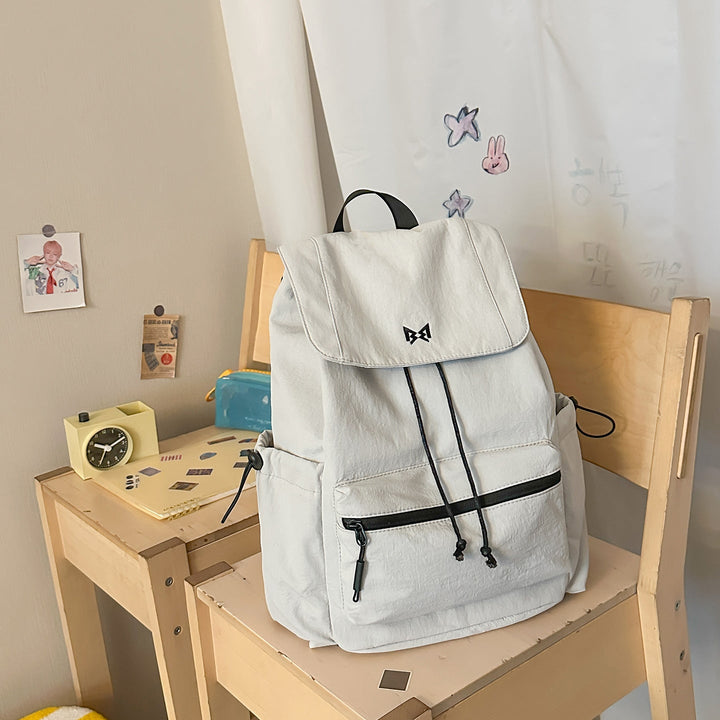 Chic unisex daypack for urban exploration & light travel. Durable, water-resistant, with ample storage & multiple pockets.
