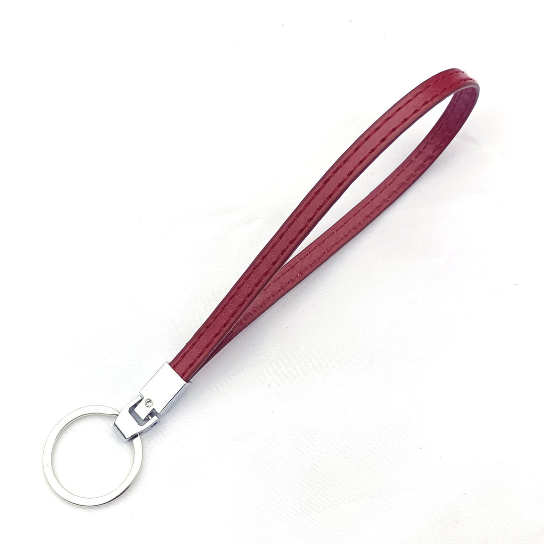 Vibrant red key holder, a durable and portable keychain organizer. A stylish accessory for organized keys.